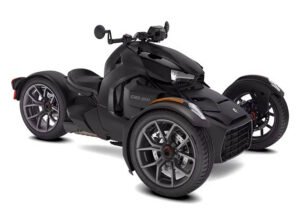 A black Can-Am Ryker three-wheeled motorcycle with a sleek, sporty design, featuring two front wheels and a single rear wheel. The vehicle has sharp, angular body lines, alloy wheels, and ergonomic handlebars.