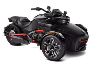 A sleek black Can-Am Spyder F3-S Monolith Black Edition three-wheeled motorcycle featuring an aggressive design with red accents. The vehicle has two front wheels, a single rear wheel, a comfortable black seat, and alloy wheels. The bike showcases aerodynamic bodywork, ergonomic handlebars, and a sporty appearance.