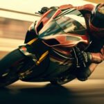 Motorcyclist in full racing gear riding a yellow sport bike at high speed on a racetrack
