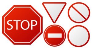 Five red traffic signs: a stop sign (octagon), a yield sign (inverted triangle), a prohibition sign (circle with diagonal slash), a do not enter sign (red circle with white bar), and a blank circular sign with a red border.