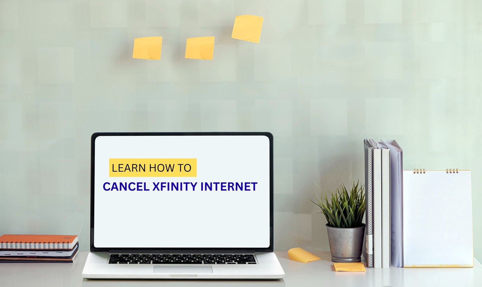 Laptop on a desk displaying “Learn How to Cancel Xfinity Internet” with office supplies and sticky notes in the background.